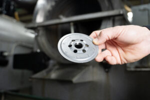 A precision-stamped tapping plate manufactured on long-life tooling at Pax Machine Works, Celina, Ohio